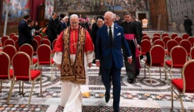Pope Leo XIV and King Charles III walk together in the Sistine Chapel during a historic meeting that included a prayer service at the Vatican, Thursday, Oct. 23, 2025.