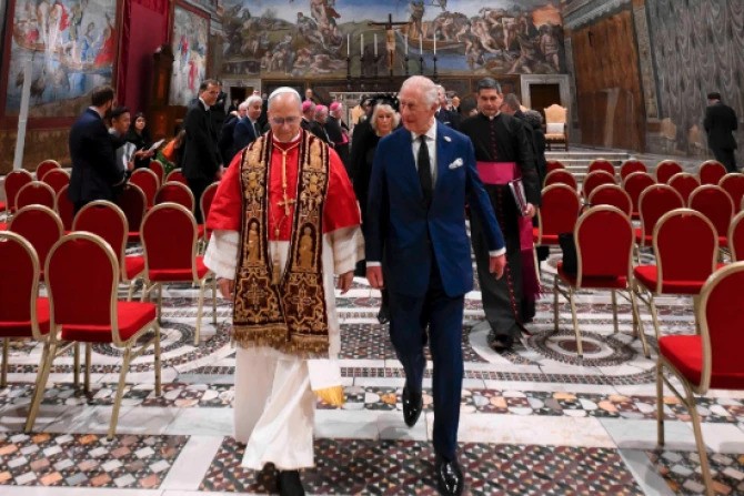 Pope Leo XIV and King Charles III walk together in the Sistine Chapel during a historic meeting that included a prayer service at the Vatican, Thursday, Oct. 23, 2025.