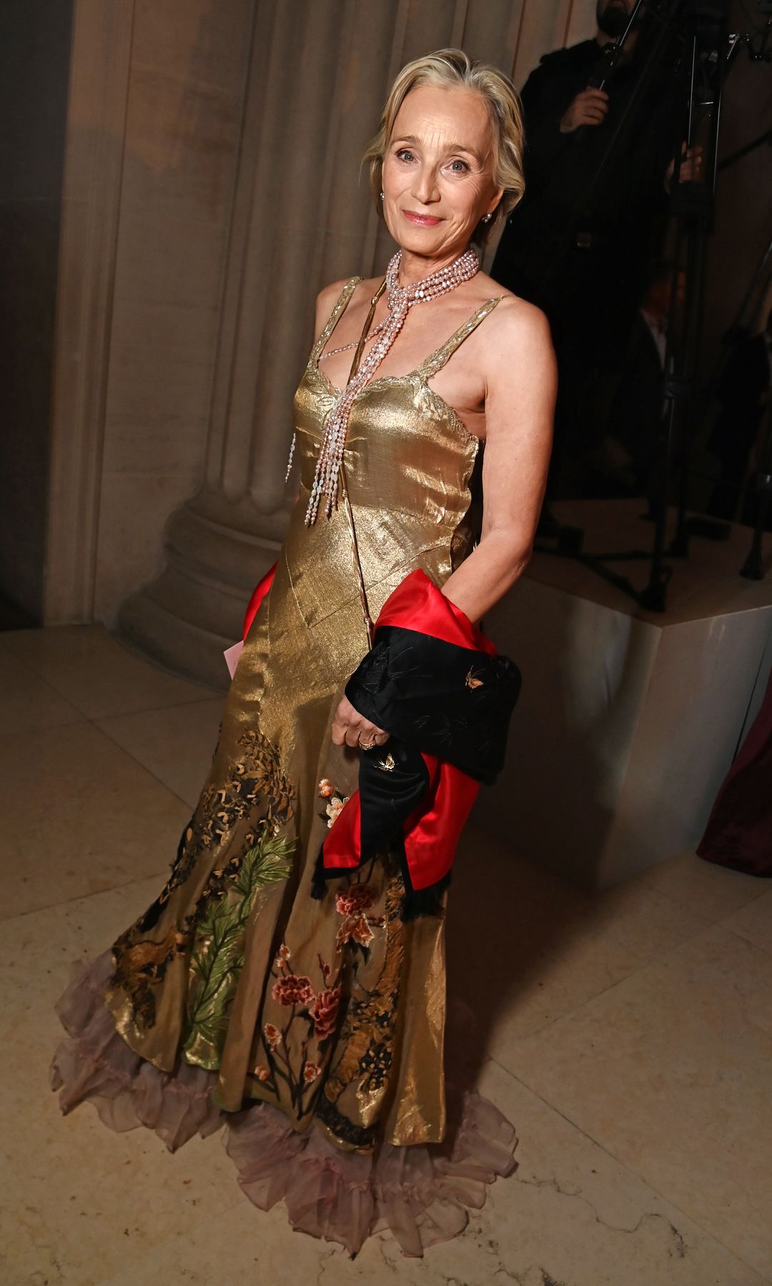 Kristin Scott Thomas in a gold dress