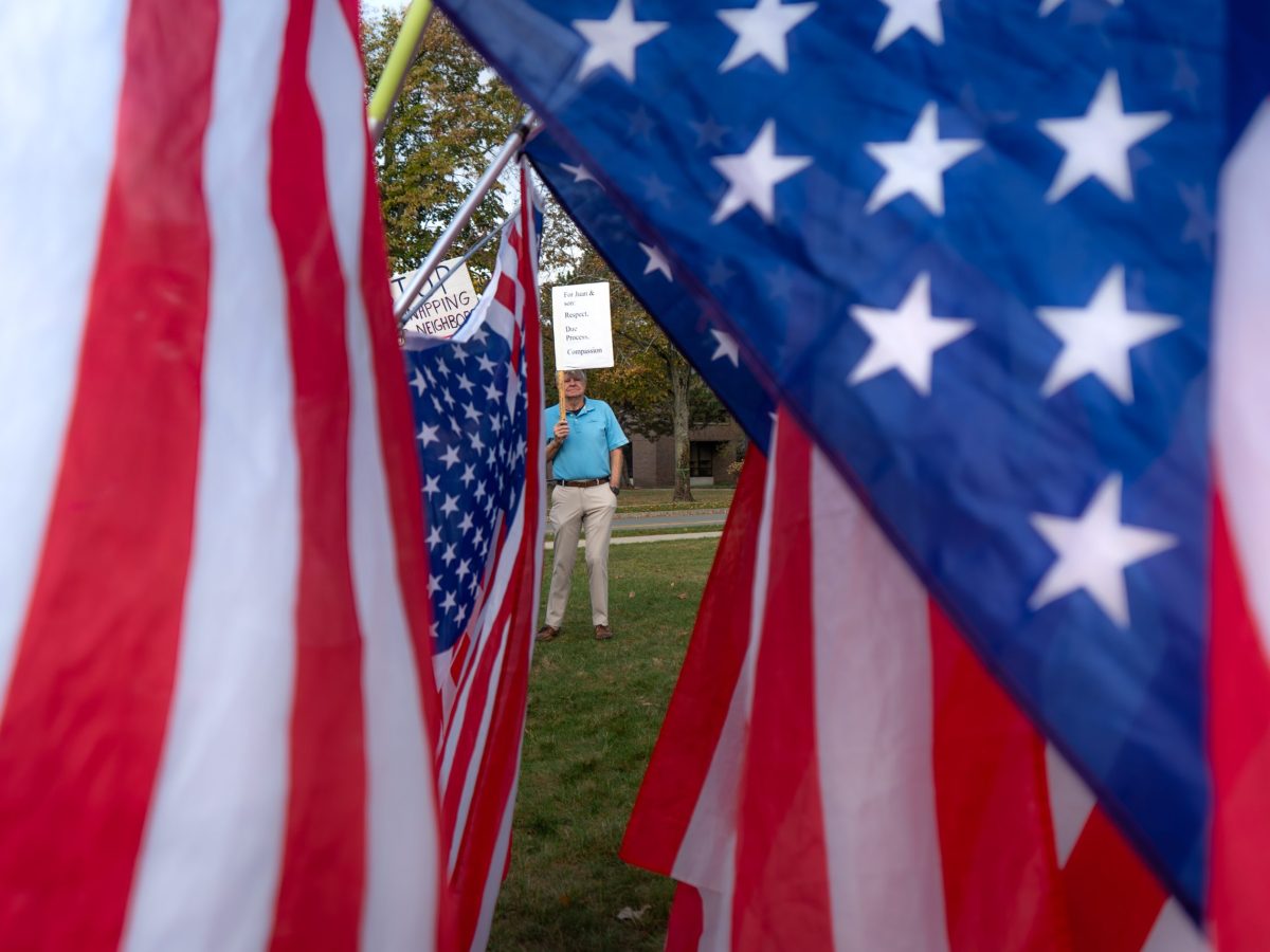 Protesters show solidarity with New Bedford father, son at ICE check-in