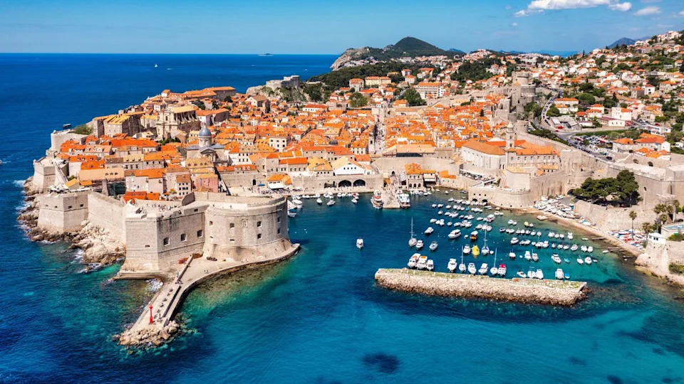 Dubrovnik a city in southern Croatia fronting the Adriatic Sea, Europe. Old city center of famous town Dubrovnik, Croatia. Picturesque view on Dubrovnik old town (medieval Ragusa) and Dalmatian Coast.