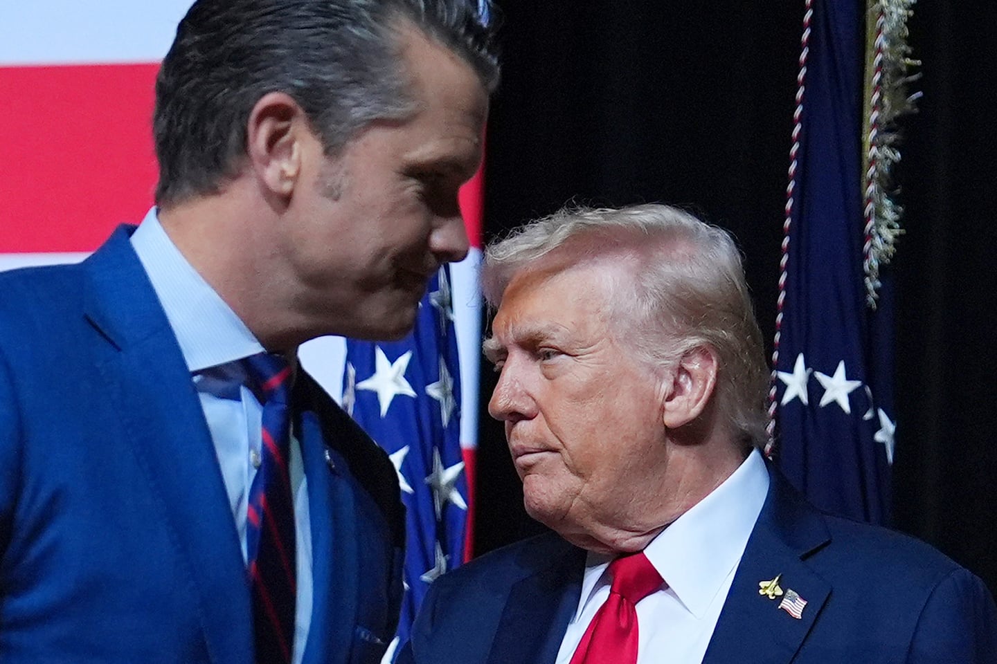 President Trump is greeted by Secretary of Defense Pete Hegseth.