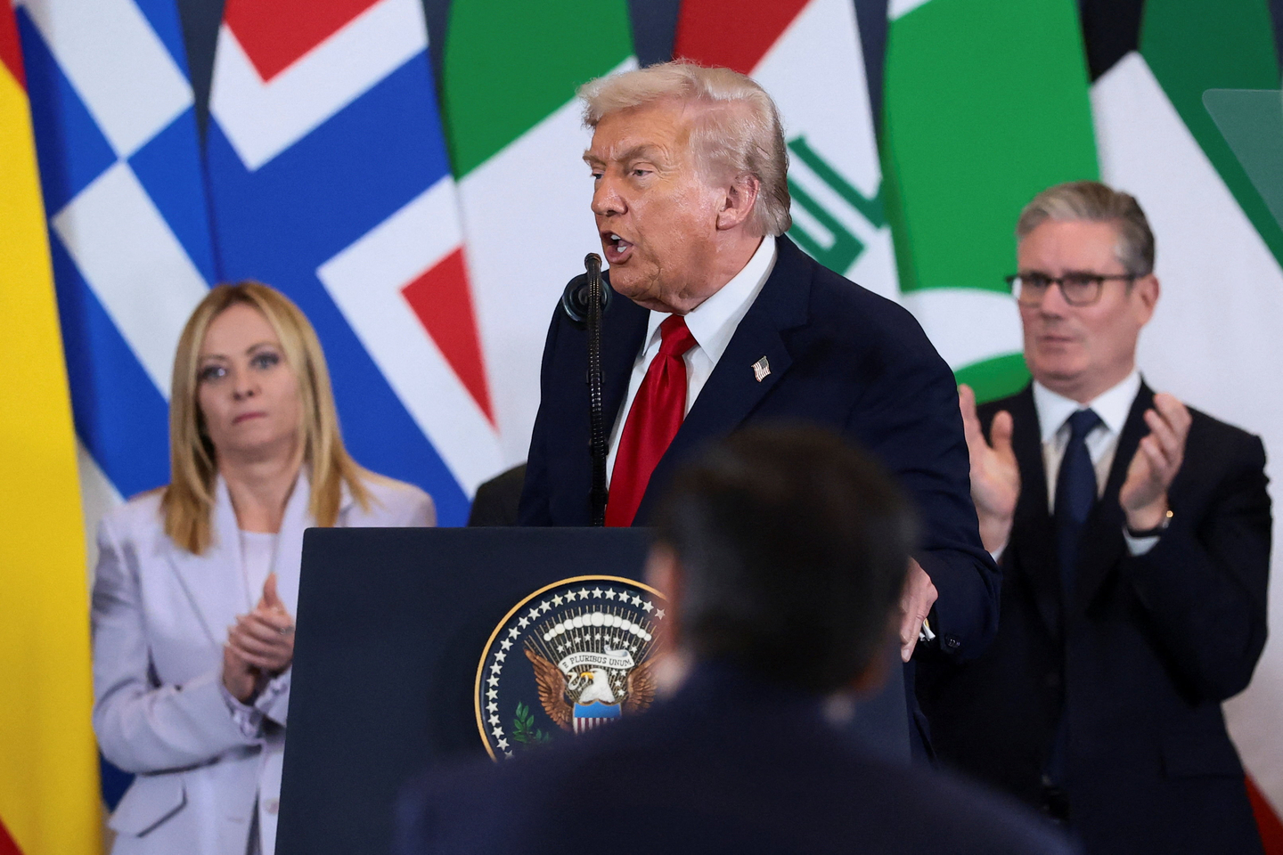 U.S. President Donald Trump delivers remarks, as Italian Prime Minister Giorgia Meloni and British Prime Minister Keir Starmer applaud, following the official signing of the first phase of the Gaza ceasefire agreement between Israel and Hamas, during a world leaders' summit on ending the Gaza war, in Sharm El-Sheikh, Egypt, Oct. 13, 2025. [REUTERS/YONHAP]