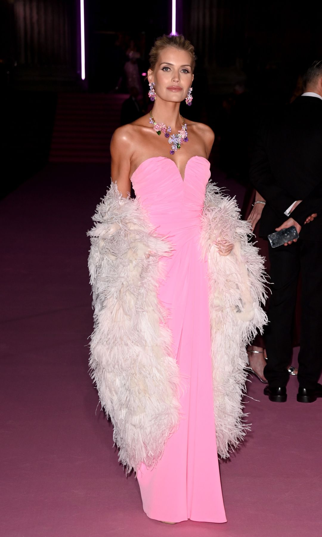 Lady Kitty Spencer in a pink dress and fur coat