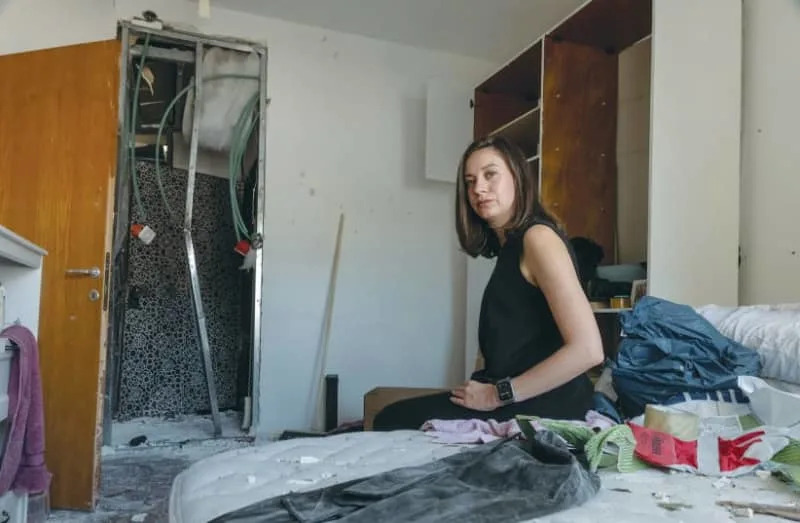 Shanna Fuld surveys the destruction of her apartment on Ben Yehuda Street in the aftermath of the June 16th Iranian missile strike. (credit: Chen Schimmel/The Jerusalem Post)