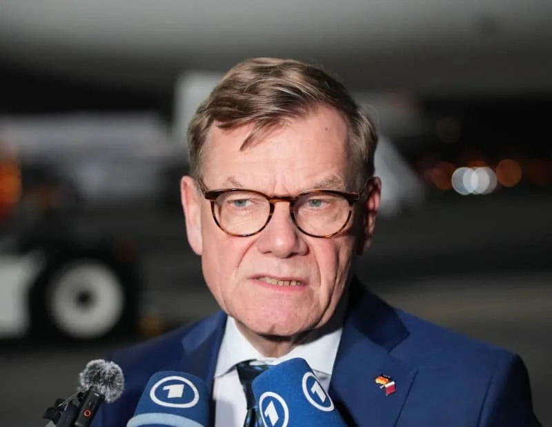 German Foreign Minister Johann Wadephul makes a statement on the airport tarmac before his departure for Kuwait. Soeren Stache/dpa