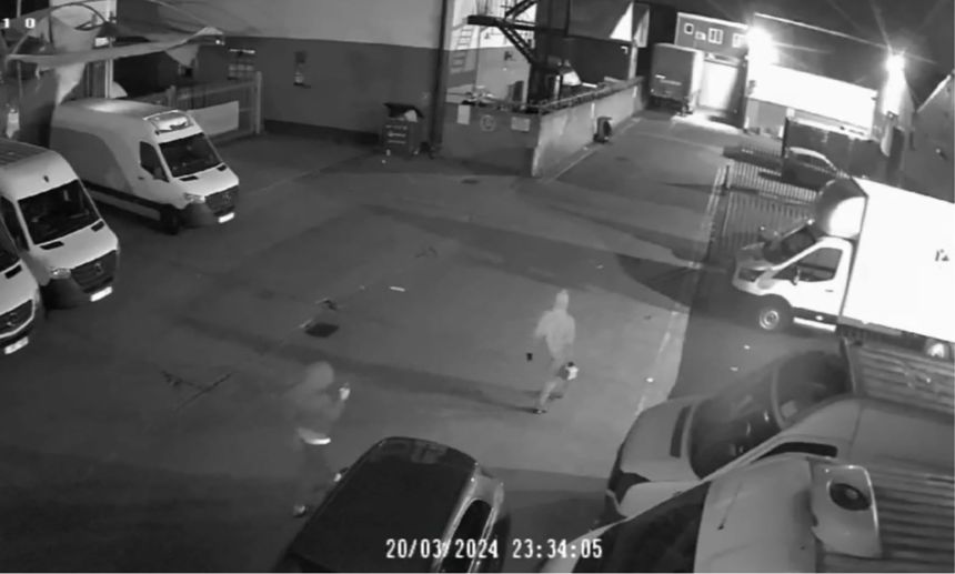 A still from security camera footage showed two men carrying a jerry can at the industrial estate in London.