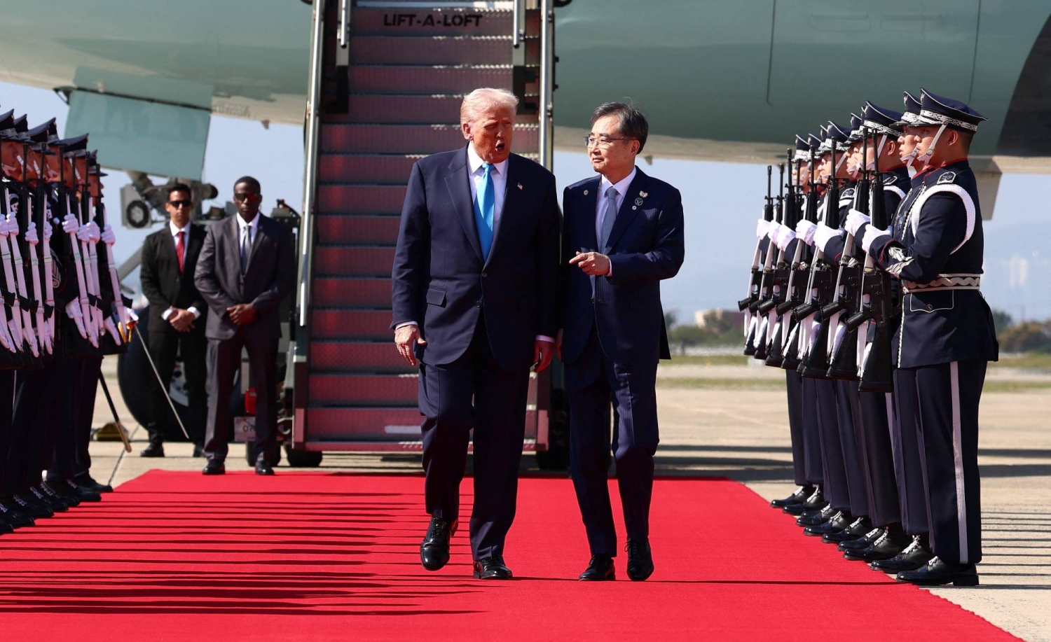 Trump lands in South Korea to face trade talks and North Korean missiles