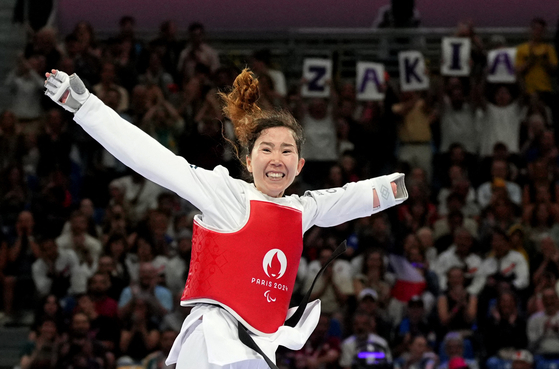 Zakia Khudadadi, a taekwondo athlete of the Refugee Paralympic Team, celebrates her winning at the Paris 2024 Paralympics on Aug. 24, last year. [REUTERS/YONHAP]