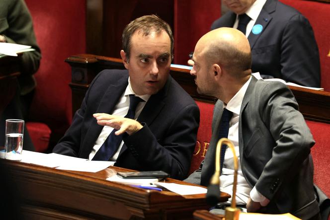 French Prime Minister Sebastien Lecornu (L) speaks with Foreign Affairs Minister Jean-Noël Barrot, after delivering his general policy statement to MPs at the Assemblée Nationale, in Paris, on October 14, 2025.