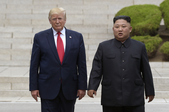 U.S. President Donald Trump, left, meets with North Korean leader Kim Jong-un on the North Korean side of the border at the village of Panmunjom in the demilitarized zone on June 30, 2019.. [AP/YONHAP]