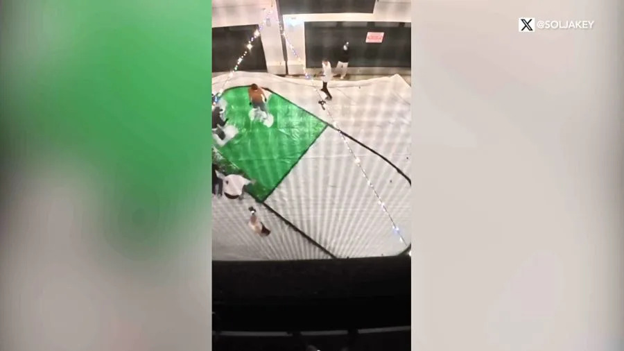 A cryptocurrency crew is seen constructing a sign to hang on the Hollywood sign. September 2025. (@SoIJakey via X)