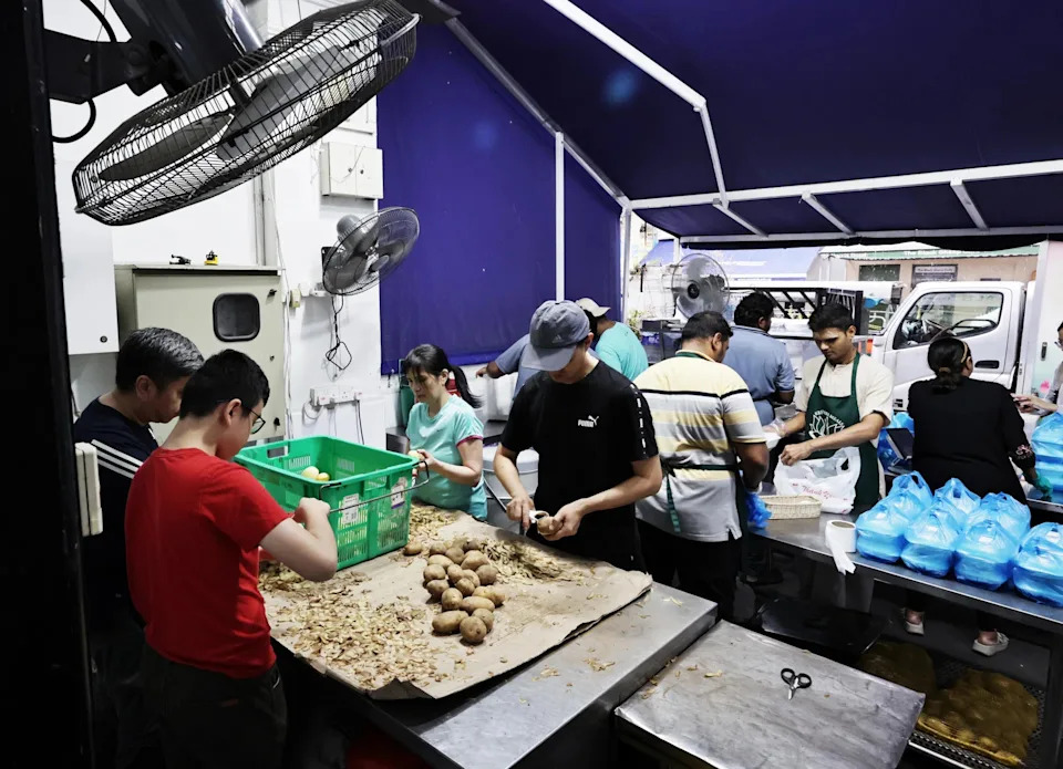 At least 24 volunteers, some of whom are migrant workers, help out at the Krsna’s Free Meals kitchen every day.