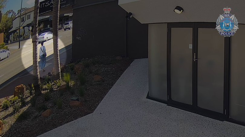 Ms Leahy seen holding a blue bag.