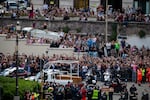 People gather along the road as the coffin of the late Pope Francis is transported from St. Peter's Basilica to Santa Maria Maggiore Basilica during the funeral ceremony in Rome, Italy, on April 26, 2025. (Photo by Massimo Valicchia/NurPhoto via Getty Images)
