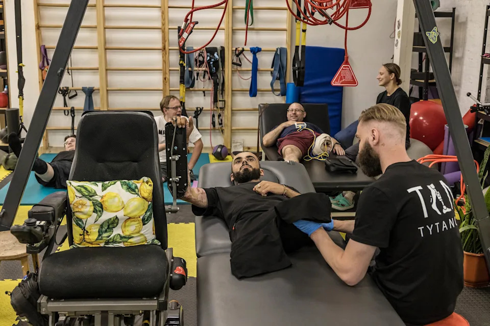 War veterans exercise at the Tytanovi rehabilitation centre for veterans in Kyiv.