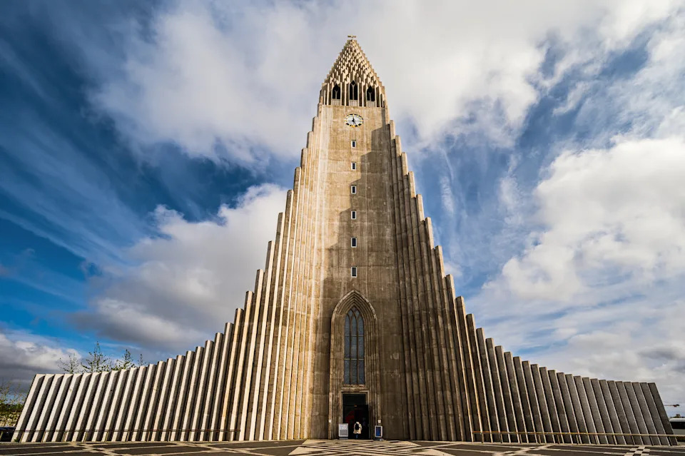 views of the Hallgrímskirkja church with a cloudy sky in the background, Reykjavik