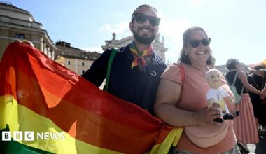 Pilgrims march to pass the holy door of St Peter's basilica during the LGTB jubilee, at the Vatican, on September 6, 2025. In a first for the Vatican, more than a thousand LGBTQ Catholics and their supporters are this weekend holding a pilgrimage
