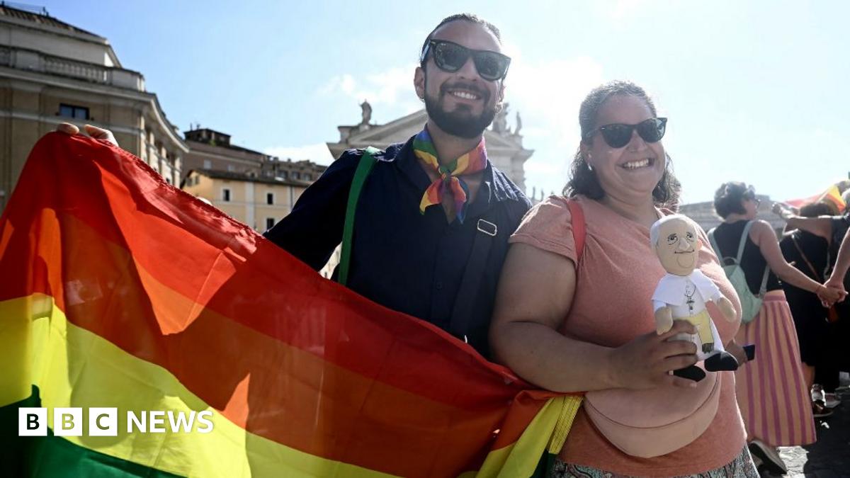 Pilgrims march to pass the holy door of St Peter's basilica during the LGTB jubilee, at the Vatican, on September 6, 2025. In a first for the Vatican, more than a thousand LGBTQ Catholics and their supporters are this weekend holding a pilgrimage