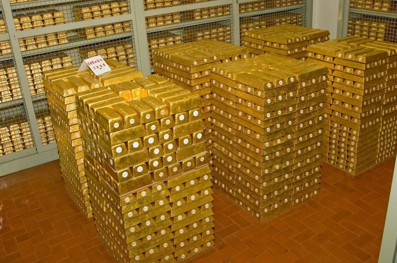 A secure room inside the Bank of Italy’s gold vault is filled with stacked gold bars stored along the corridor and behind metal security cages in an undated handout picture, in Rome, Italy