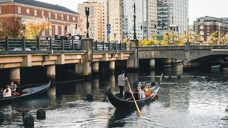 Two gondolas glide on the river in Providence, Rhode Island