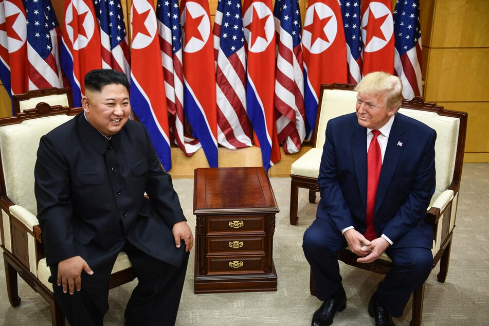 North Korea's leader Kim Jong Un (l.) and US President Donald Trump (r.) attend a meeting on the south side of the Military Demarcation Line that divides North and South Korea, in the Joint Security Area (JSA) of Panmunjom in the Demilitarized Zone (DMZ) on June 30, 2019.