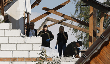 Police and army officials inspect damage to a house destroyed by debris from a Russian drone shot down Sept. 10 over the village of Wyryki-Wola in eastern Poland. NATO air defenses helped counter drones that Polish officials say violated Polish airspace overnight. (Photo by Wojtek Radwanski/AFP via Getty Images)