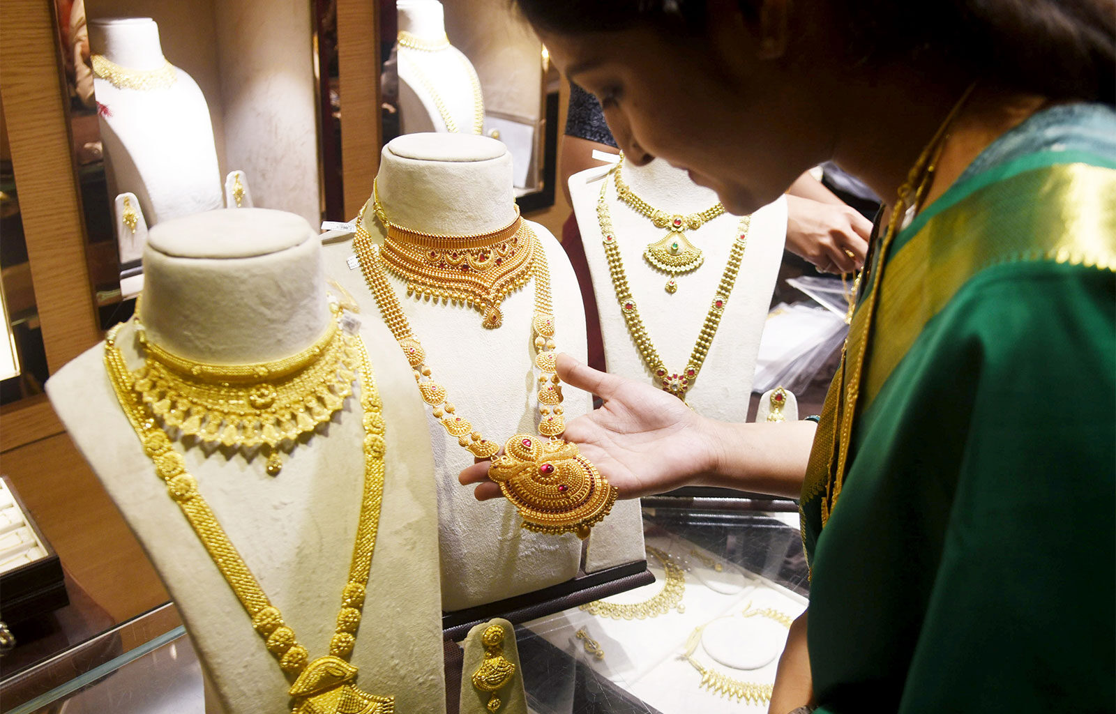 Gold prices touch new highs on weak dollar, fiscal worries, central banks buying: Report