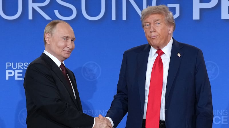 President Donald Trump and Russian President Vladimir Putin shake hands at the end of a press conference at Joint Base Elmendorf-Richardson on August 15, 2025 in Anchorage, Alaska where they did not take any questions and did not reveal anything had been achieved at their meeting besides a promise for more talks.