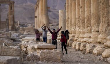 Children play, with one raising the V sign, at the ancient city of Palmyra, Syria, Saturday, Jan. 25, 2025. (Khalil Hamra/AP)