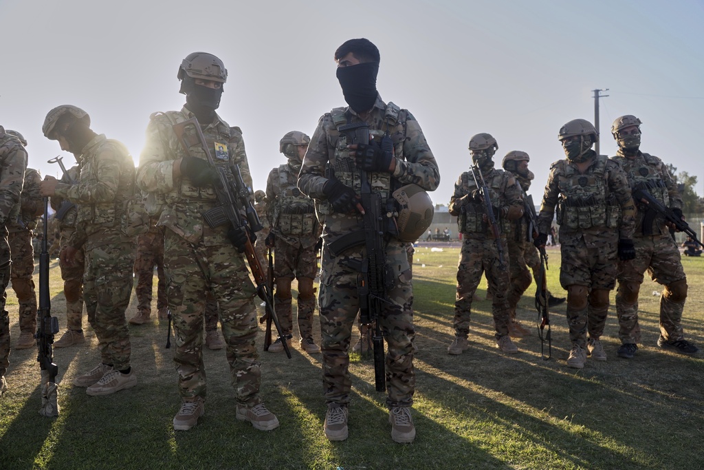 Fighters from the Syrian Democratic Forces prepare to attend a military parade before the funeral of senior Kurdistan Workers' Party leader Nuredin Sofi.