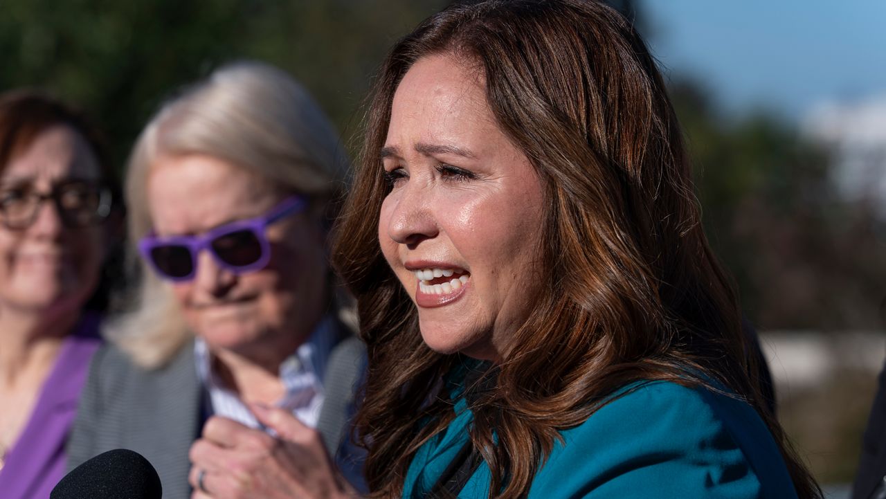 Rep.-elect Adelita Grijalva, D-Ariz., speaks as she is surrounded by supporters who have urged that House Speaker Mike Johnson swear her in, at the Capitol in Washington, Wednesday, Oct. 15, 2025. (AP Photo/J. Scott Applewhite)