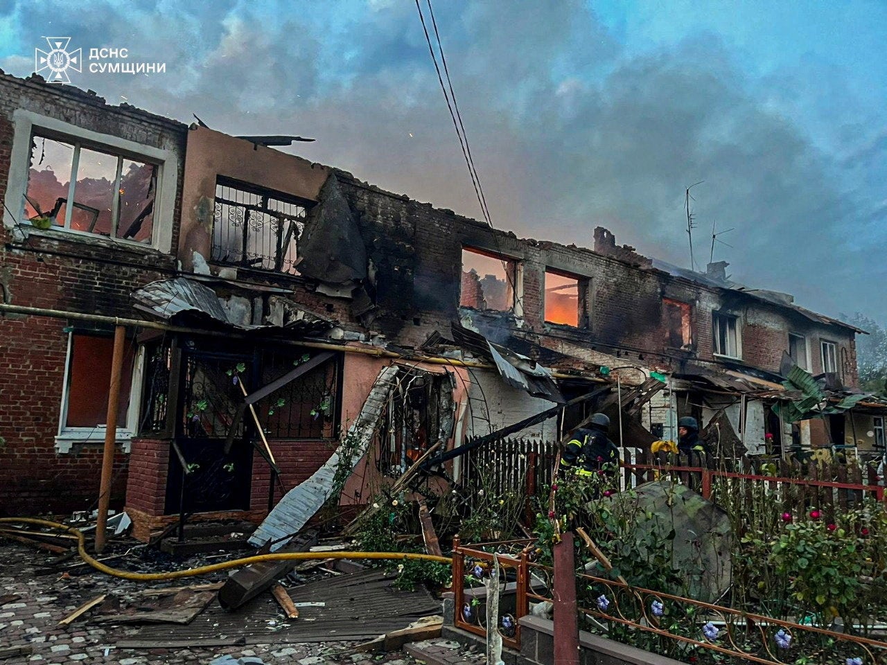 Firefighters work at the site of a Russian drone strike, amid Russia's attack on Ukraine in Sumy region