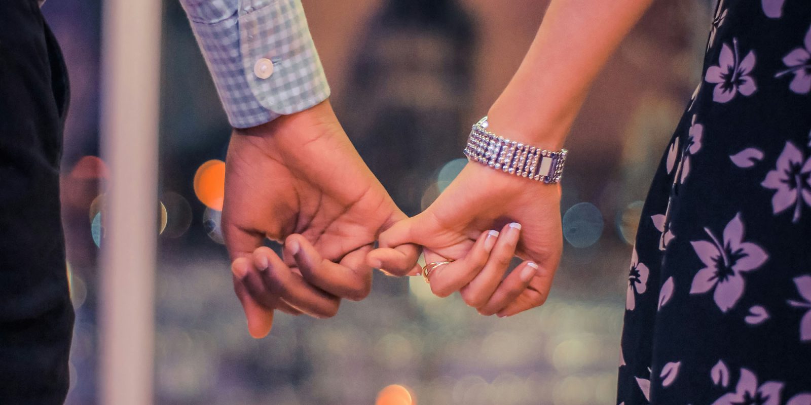 Apple reportedly close to settling with the EU over Digital Markets Act violations | Photo shows a couple holding hands
