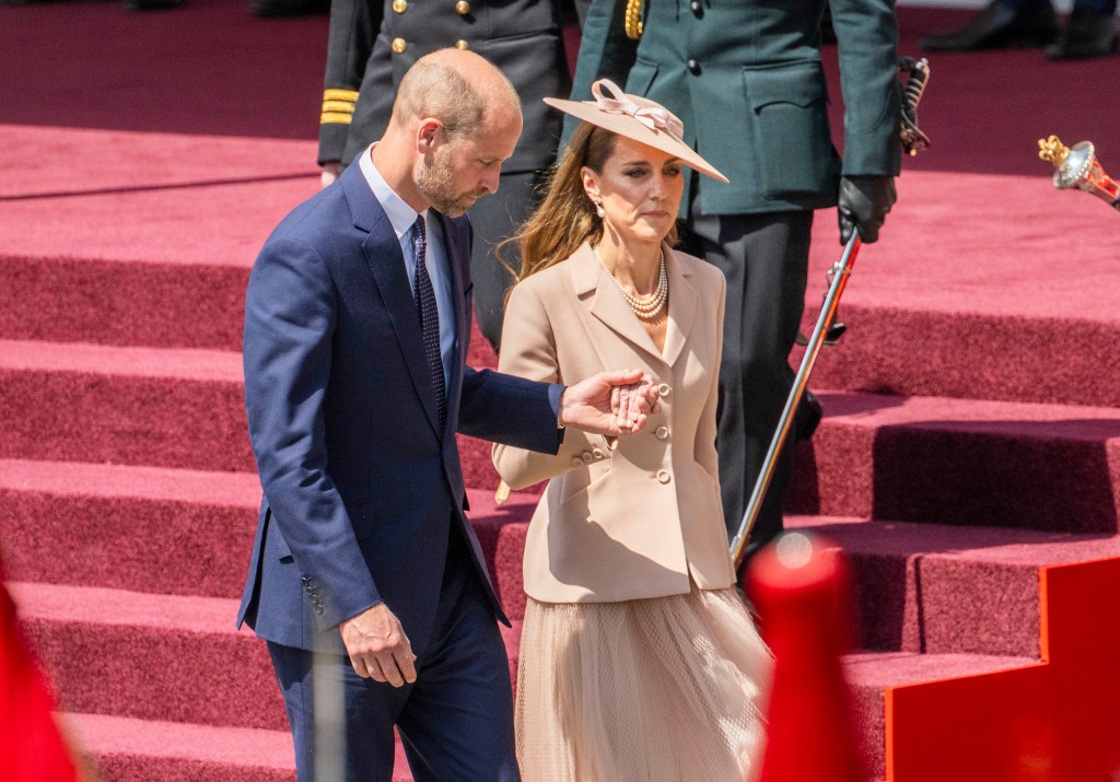 Prince William holding Kate Middleton's hand during French president's state visit