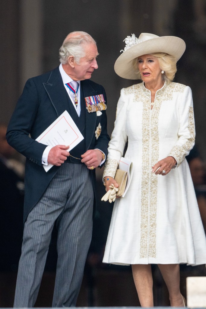 King Charles and Queen Camilla together in suit and dress 