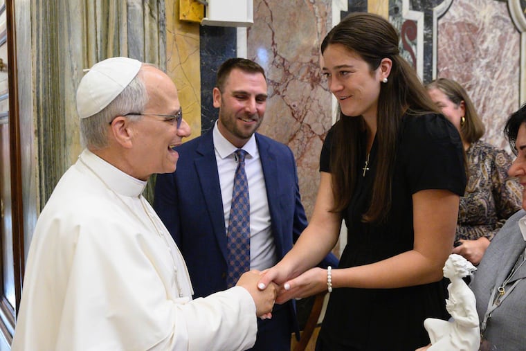 Villanova basketball alum Maddy Siegrist shakes fellow Villanova alum Pope Leo XIV's hand at the Vatican.