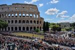 The coffin of Pope Francis passes the Colosseum in Rome.