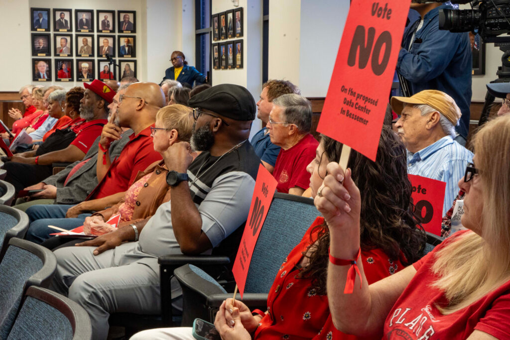 Bessemer residents dress in red to show their opposition to Project Marvel during a City Council meeting in August. Credit: Lee Hedgepeth/Inside Climate News