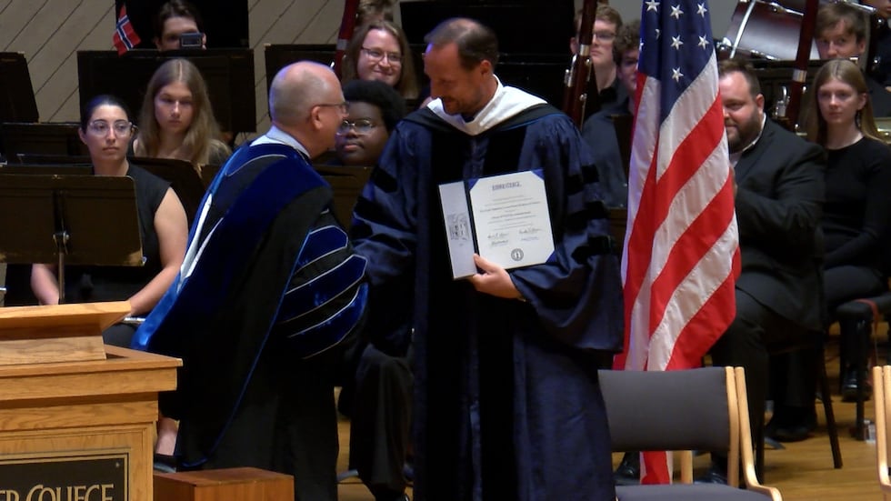 (Figure 4 of 5): Prince Haakon of Norway accepting an honorary degree from Luther College...