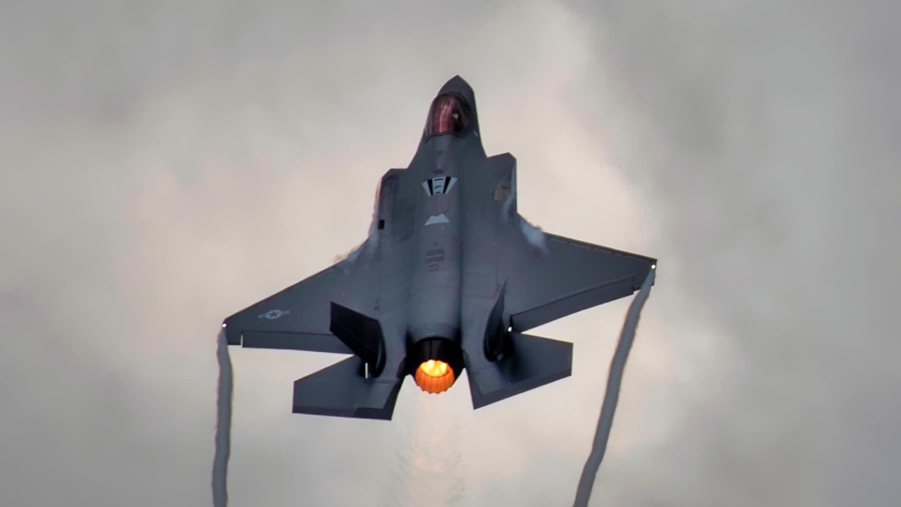 A U.S. Air Force F-35A Lightning II aircraft with the Wisconsin Air National Guard's 115th Fighter Wing ascends into the clouds during exercise Northern Lightning Aug. 9, 2024, at Volk Field. Wisconsin. The F-35 works in parallel with 4th generation fighters, demonstrating the strength of combined airpower in the face of strategic competition. (U.S. Air National Guard photo by Staff Sgt. Constantine Bambakidis)