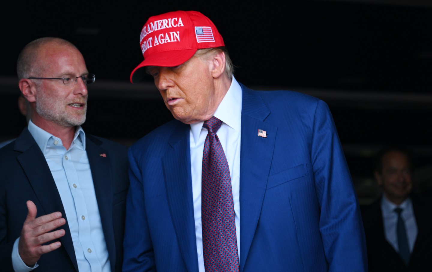 President-elect Donald Trump speaks to Brendan Carr, his intended pick for Chairman of the Federal Communications Commission, as he attends a viewing of the launch of the sixth test flight of the SpaceX Starship rocket on November 19, 2024 in Brownsville, Texas.