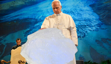 Pope Leo XIV delivers a speech with a chunk of glacial ice during a climate conference on Wednesday in Albano Laziale, Italy. Credit: Simone Risoluti/Vatican Media via Getty Images