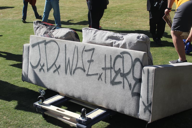 couch tagged with the words ‘J.D. Vance waz here’