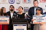 Reyna Lopez, President and Executive Director of PCUN, speaks at a press conference alongside Metro Councilor Juan Carlos González, center left, and President of the OregonAFL-CIO Graham Trainer, center right, in Portland, Ore., on Friday, Oct. 31, 2025. Leaders gathered to denounce a surge in recent ICE arrests in the Willamette Valley farming community and residential areas, where hundreds of immigrants have been arrested in the last month.