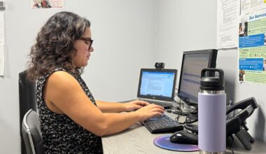A mental health counselor works at the Mental Health Association of Central Florida, ready to help callers with crisis counseling. (Spectrum News)