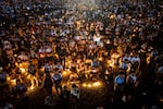 An aerial image shows Catholic believers holding candles during Pope Francis's requiem mass at the Esplanade of Tasitolu in Dili, East Timor, where he held a Mass in September last year, on April 26, 2025, as his funeral takes place in Vatican. 