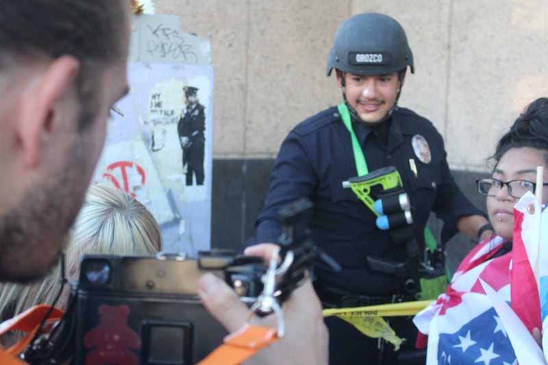 LAPD officer fist bumping.