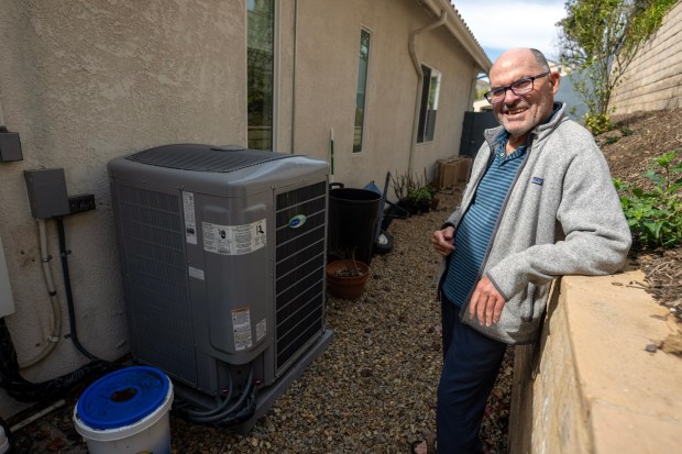 FILE -- George Vine with his high efficiency all-electric HVAC system at his home in Thousand Oaks on Monday, Feb. 17, 2025. (Photo by Hans Gutknecht, Los Angeles Daily News/SCNG)