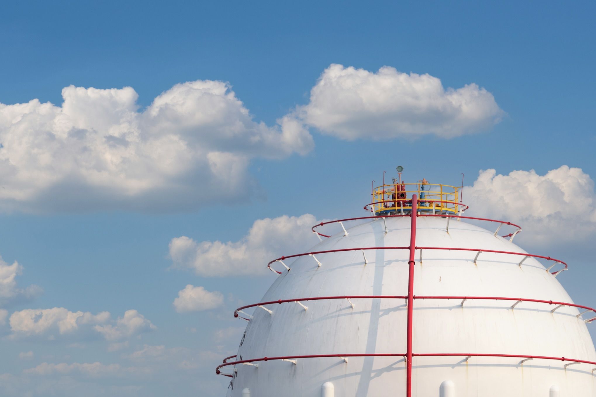 Industrial gas storage tank. LNG or liquefied natural gas storage tank. Spherical Gas reservoirs in petroleum refinery. Above-ground storage tank. Natural gas storage industry. Ball shape lpg tank.